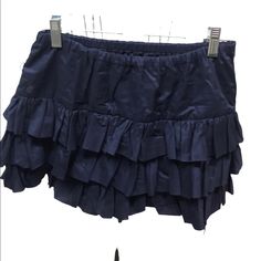 Navy Ruffled Skirt Elastic Waist 100% Cotton Waist Flat 13 Inches Approximately Length 13 1/2 Inches Approximately Closet #2a Cotton Mini Skort With Ruffles, Ruffled Cotton Skort, School Skirt With Ruffles In Cotton, School Skirt With Cotton Ruffles, Blue Cotton Tiered Skort, Blue Cotton Bottoms With Ruffle Hem, Spring Mini Skirt With Ruffles For School, Blue Ruffled Skort, Cotton Ruffled Skirted Skort