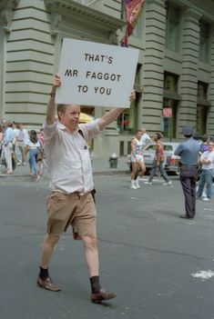 a man holding up a sign that says, that's mr fagot to you