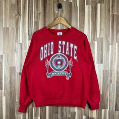 Vintage 80a Ohio State University Sweatshirt Ohio State Crewneck Ohio State Sweater Sportswear Ohio State Buckeyes Print Red Large *50% Cotton. *50% Polyester *Delta  tag *Made in Usa *Tag reads:   Size : Large (check measurements below) *Manual size measurement  Width : 22.5" inches (armpit to armpit)                           Length : 26" inches  All measurements are taken with the garment flat on the ground. *Condition: please look at picture refer picture really Nice condition refer picture Ohio T Shirts, State Crewneck, Vintage Ohio State, University Sweatshirts, Ohio State University, Ohio State Buckeyes, Ohio State, State University, Ohio