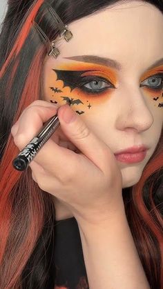 Bat wing Halloween eyeliner tutorial 🦇🧡🖤 Halloween Makeup Batgirl, Bat Face Makeup Halloween, Bat Eye Makeup Halloween, Cute Bat Makeup Halloween, Bat Woman Makeup Halloween, Bat Halloween Costume Makeup, Bat Woman Makeup, Bat Eyeliner Halloween, Bat Inspired Makeup