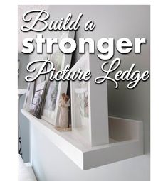 a white shelf with pictures on it and the words build a stronger picture ledge