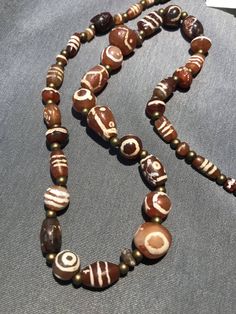 Unique Brown Beaded Necklace With Polished Beads, Bohemian Single Strand Round Beads, Unique Brown Polished Beads, Brown Amulet Beads For Jewelry Making, Unique Handmade Carnelian Beads, Brown Amulet Necklaces With Large Beads, Unique Carnelian Necklaces With Large Beads, Carnelian Necklaces With Large Beads, Bohemian Single Strand Agate Necklace