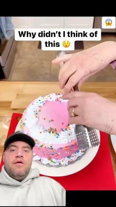 a person cutting a cake on top of a table