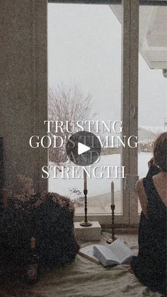 a woman sitting on top of a bed in front of a window with the words trusting god's living strength