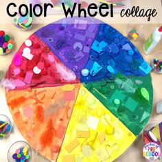 the color wheel collage is made with colored paper and plastic beads, which are scattered around it