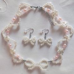 a necklace and earring set with pearls