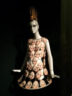 a mannequin is dressed up in an unusual dress