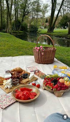 a picnic table with food and drinks on it