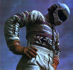 a man in an astronaut's suit and helmet with his hands on his hips