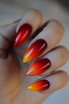 Dive into the fall season with these striking red and orange ombre nails! The sharp stiletto shape adds an extra edge to your style, making these nails a must-try for autumn. 🍁💅 Get inspired with more fall nail ideas at NailHow.com. Fire Ombre Nails, Orange Burgundy Nails, Autumn Nails Ombre, Red Orange Ombre Nails, Ombre Red Nails, Red And Orange Nails, Fall Ombre Nails Ideas, Orange Ombré Nails, Autumn Ombre Nails