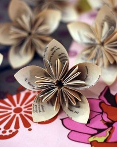 an origami flower sitting on top of a table