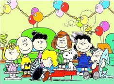 a group of cartoon characters sitting on top of a red couch in front of balloons