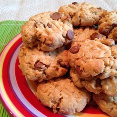 a plate full of peanut butter cookies on top of a green and red table cloth