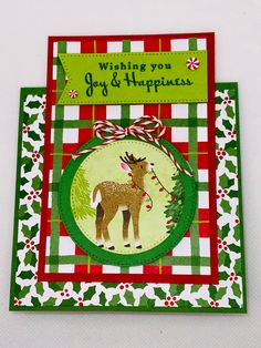 a handmade christmas card with an image of a deer