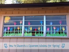 the window is decorated with colorful hand prints