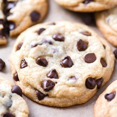 chocolate chip cookies are arranged on top of each other, with one cookie in the middle