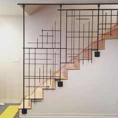 a set of stairs that are next to each other in a room with white walls