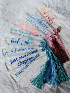 four tassels with words on them sitting on a piece of paper that says, you're one more important than family