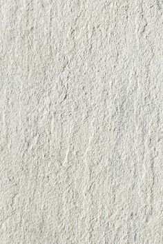 the texture of white sand is shown in close up, as if it were made out of cement