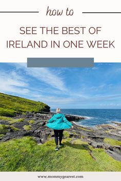 a woman standing on top of a lush green hillside next to the ocean with text overlay reading how to see the best of ireland in one week