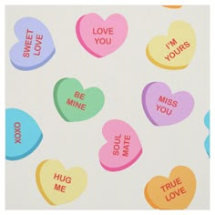 candy hearts with the words i'm mine and true love written on them in different colors