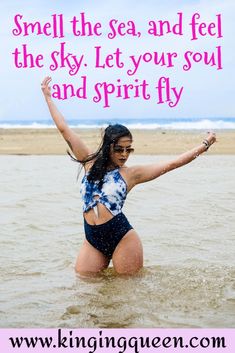 a woman in a bathing suit standing in the water with her arms outstretched and saying, smell the sea and feel the sky let your soul and spirit fly