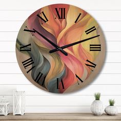 a large clock on the wall with roman numerals and an abstract painting design