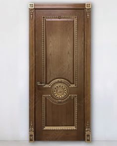 a wooden door with an ornate design on the front and side panels, painted in dark brown