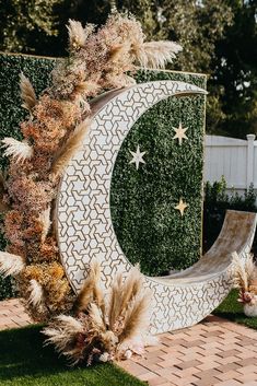 an artificial moon and star decoration in the garden