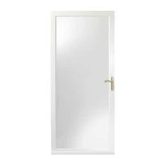 a white door with a gold handle on the left side and a mirror above it