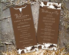 two brown and white wedding programs on some hay