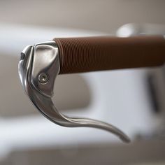 a close up view of a handle on a chair