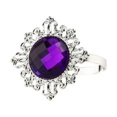 a large purple stone surrounded by filigrees on an ornate silver plated ring