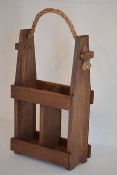 a wooden holder with rope hanging from it's sides