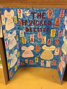 a bulletin board with the words the hundred dresses written on it and pictures attached to it