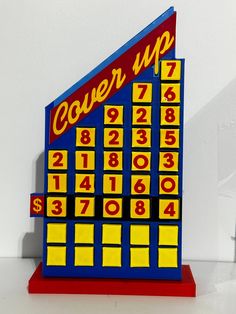 a close up of a clock made out of lego blocks with numbers on each side