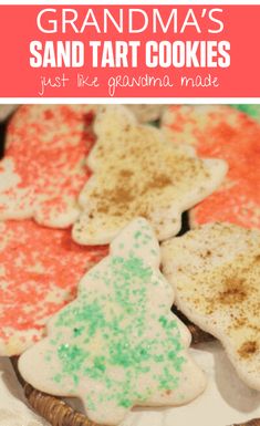 some cookies that are on a plate with the words grandma's sand tart cookies just like grandma made