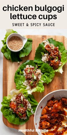 chicken lettuce cups with sweet and spicy sauce on a cutting board next to a bowl of rice