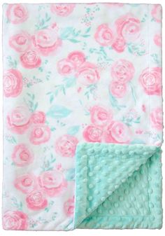 a blanket with pink roses on it