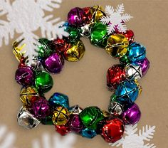 a colorful christmas ornament on a table with snowflakes