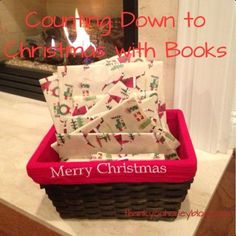 a basket filled with books sitting on top of a counter next to a fire place