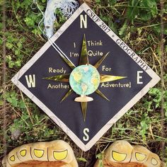 someone's feet are shown in front of a graduation cap