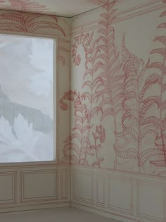 the corner of a room with a window and wallpaper on it, painted in red