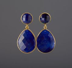 This pair of two tier genuine gemstone (sapphire) earrings would be a nice reward for your self or a great gift for your mother or best friend. Each one has two tiers of natural stones:1. top tier: a small (11mm) round sapphire in gold bezel2. bottom tier: a large pear shaped sapphire (natural gemstone) stone (about 25 x 19 mm) set in gold bezel    Note: other stone combinations available. Please inquire.3. earring total length ~ 40 mm4. bezel material: 24k gold plated5. earring wire: 24k gold p Sapphire Earrings Drop, Sapphire Earring, Amazonite Earrings, Shiny Rings, Earring Wire, Sterling Silver Locket, September Birthday, Round Sapphire, Jade Earrings