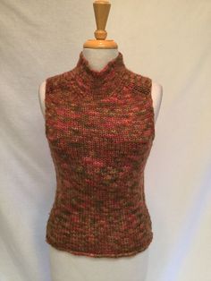 Beautiful hand knit wool sleeveless turtleneck, perfect Autumn colors. Wear belted or alone, great addition to your wardrobe!  Smoke-free home, bid with confidence! LS Fitted Brown Sleeveless Sweater Vest, Brown Knitted Sleeveless Vest, Fitted Brown Sweater Vest, Vintage Sleeveless Brown Top, Casual Brown Stretch Vest, Brown Knitted Sleeveless Top, Brown Knit Sleeveless Vest, Brown Knit Tank Top For Fall, Brown Knit Vest Top