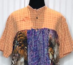 This beautiful women's shirt was upcycled using a mens orange  cotton check shirt and soft polyester blouses to fashion this easy fitting 2X shirt.  The main body is a light weight cotton orange with subtle check pattern shirt with top three button closure.  The bottom of the shirt is several polyester blouses in purple and orange patterns. This is a pop over style, but the three buttons make it easy on and off.  The sleeves half sleeve length is perfect for a stylish fit.  The two side pockets are made from one of the purple blouses. The top has been embroidered with the Little Bird Products signature bird in orange thread.   All seams are serged for longevity.  This style is flattering to any body type and the shirts used are washable and easy care.  Please review the measurements below Relaxed Fit Summer Tops With Patchwork, Casual Summer Patchwork Blouse, Patchwork Tops For Daywear In Summer, Orange Tops For Fall Daywear, Summer Patchwork Tops For Daywear, Orange Fall Tops For Daywear, Bohemian Shirt For Spring Daywear, Bohemian Spring Shirt For Daywear, Fitted Casual Shirt With Patchwork