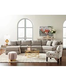 a living room with a sectional couch and chairs in front of two large arched windows