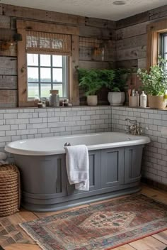 a bathroom with a tub, rug and window on the wall next to the bathtub