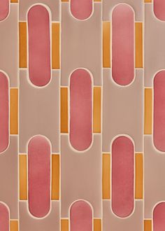 an orange and pink tiled wall with rounded shapes