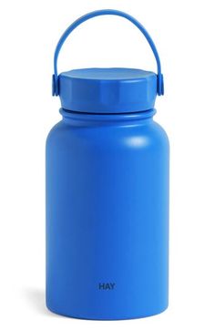 a blue water bottle with a handle on the top and an inscription that says hay